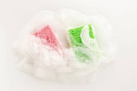 Soapy sponge with foam on white background. Cleaning conceptの写真素材