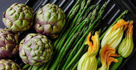 Vegetarian food concept. Fresh green vegetables on dark background. Overheadの写真素材
