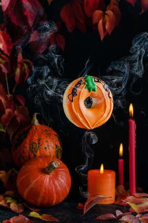Flying pumpking donut on dark halloween background.Copy space. Greeting cardの写真素材
