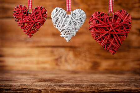 Eco friendly decorative Valentines Day hearts on wooden background. Copy space.の写真素材
