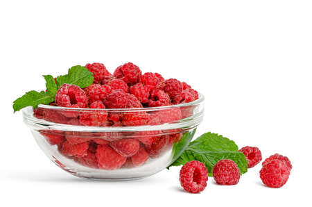 Raspberries in a transparent bowl isolated on white backgroundの写真素材