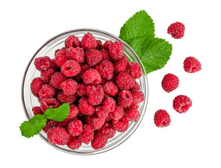 Red raspberries in a bowl isolated  . Top viewの写真素材