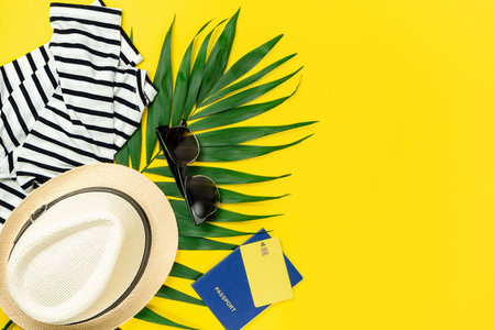 Traveler accessories on yellow summer background. Travel concept. Copy space, flat lay
