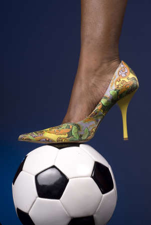 Soccer ball and multi-colored spike shoeの写真素材