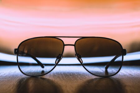 Retro sunglasses with abstract background. Long exposure light freeze photographyの写真素材