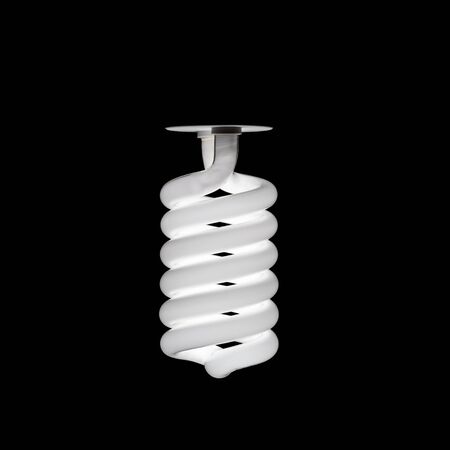 On fluorescent light bulb on isolated black backgroundの写真素材