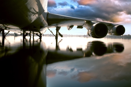 Airplane over water in the Thailand flooding at Donmaung International Airport.の写真素材