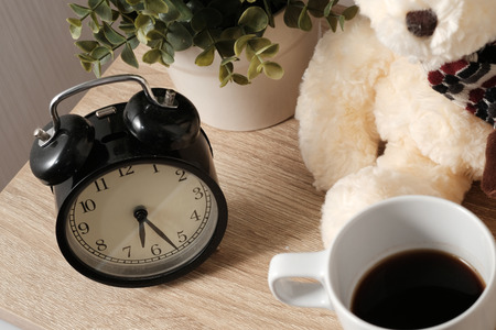 A Cup of coffee on wooden table in morning timeの写真素材