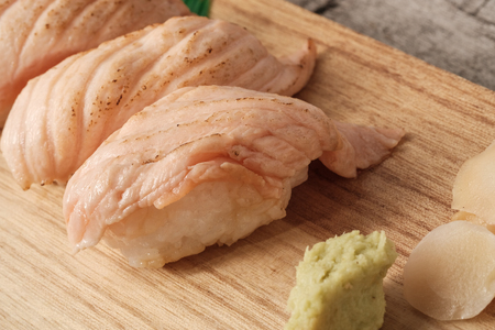 Close up salmon aburi sushi or Salmon burn top on rice japan on wooden boardの写真素材
