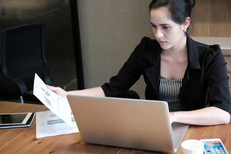 Beautiful young businesswoman is working a presentation of the project concept.の写真素材