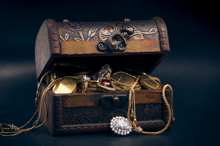 chest full of money, treasure chest with gold coinsの写真素材