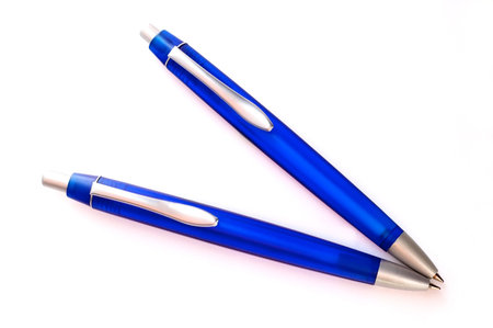 Two blue pens with white background