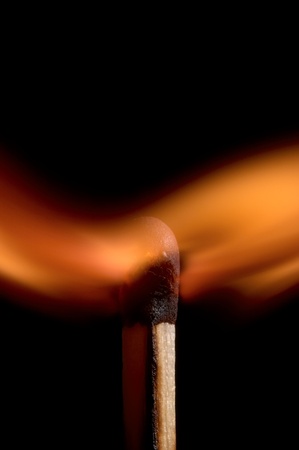 Burning matchstick on black backgroundの写真素材