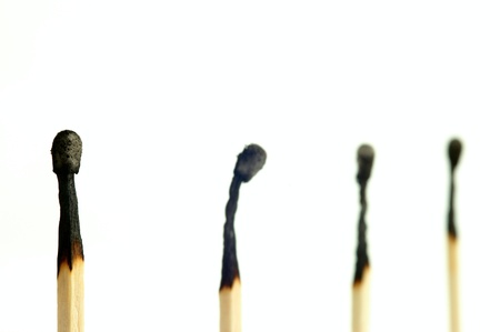 Four matches on a white backgroundの写真素材