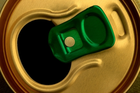 details of open green cap on the can in the color of goldの写真素材