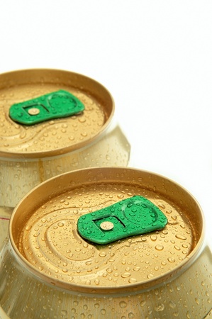 two gold-colored cans in a rowの写真素材