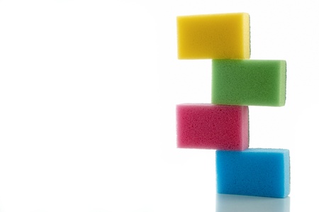different colored sponges on white backgroundの写真素材