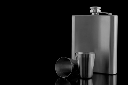 hip flask with cups on a black backgroundの写真素材