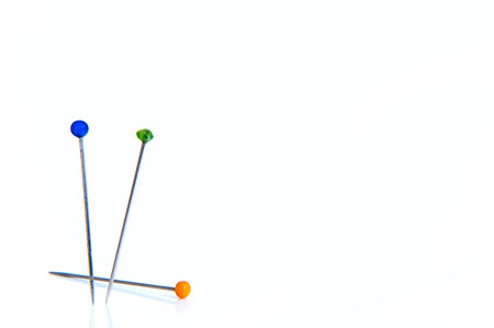 Two standing and one pin lying on a white background