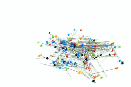 Variously coloured pins on white ground の写真素材