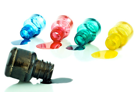 Spilled a bottle of blue, red,green,black and yellow  ink on white background