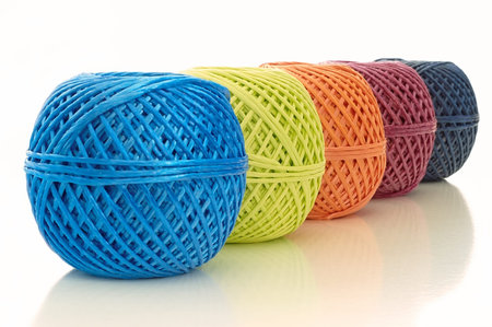 five ball of twine on a white background