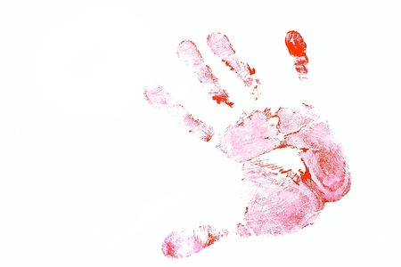Detailed view of a red hand print on white backgroundの写真素材