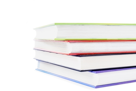 Four volumes of books on a white backgroundの写真素材