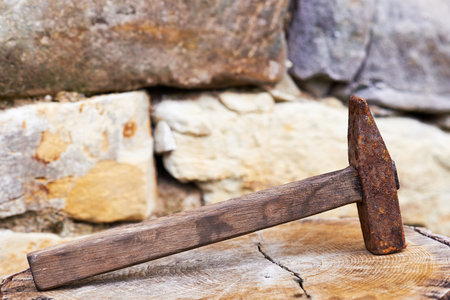 View of the old hammer on a block of wood