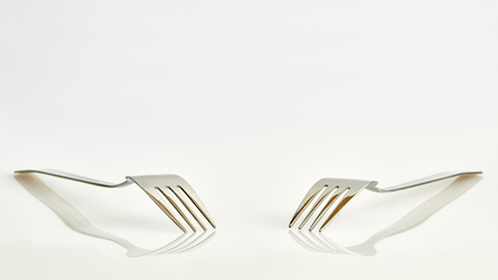 View of two forks with reflection and a clean backgroundの写真素材