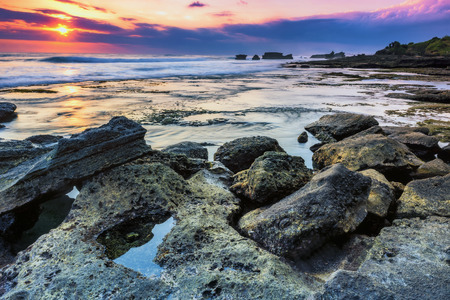 Evening view of the beach with stone and mysterious atmosphereの写真素材