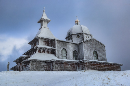 Wooden church at the top of Radhost mountain in winterの写真素材