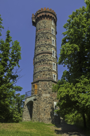 Summer view of the stone lookout tower Cvilin/Czech Republic/の写真素材