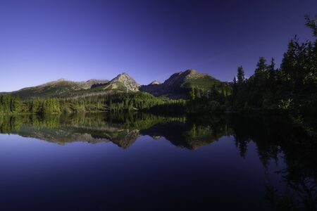 View of Strbske pleso with reflection of High Tatras on background from Slovakiaの写真素材