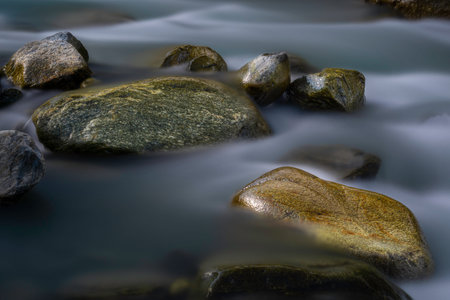Group large stones in a mountain stream flowingの写真素材
