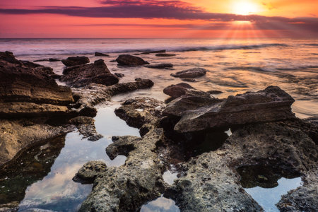 Evening view of the beach with stone and mysterious atmosphere from island Bali/Indonesia/の写真素材