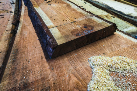 Pine wooden board lying on other wooden boards
