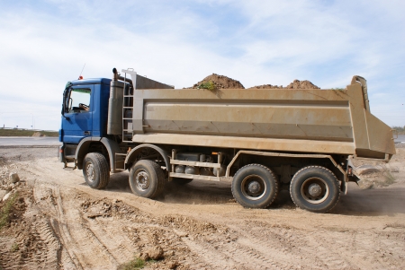 This is a view of truck on the highway building placeの写真素材