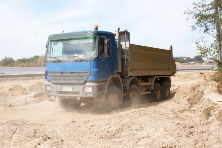 This is a view of truck on the highway building placeの写真素材