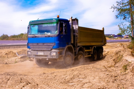 This is a view of truck on the highway building placeの写真素材