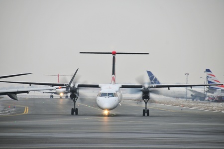 This is a view of Eurolot plane Bombardier Q400 registered as SP-EQB on the Warsaw Chopin Airport. December 31, 2014. Warsaw, Polandのeditorial素材