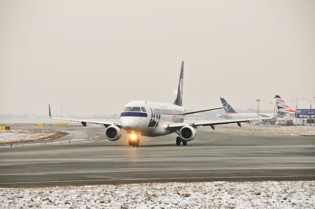 This is a view of LOT-Polish Airlines plane Embraer ERJ 170 registered as SP-LII on the Warsaw Chopin Airport. December 31, 2014. Warsaw, Polandのeditorial素材