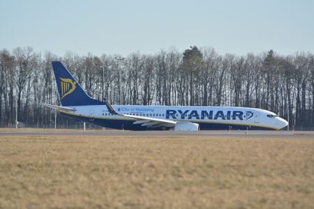 This is a view of Ryanair plane Boeing 737 8AS(WL) registered as EI-EBH over the Lublin Airport. February 17, 2015. Lublin Airport in Swidnik, Poland.のeditorial素材