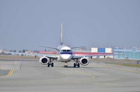 This is a view of Embraer ERJ 170 PLL LOT registered as SP-LNA on the Warsaw Chopin Airport. April 11, 2015. Warsaw, Poland.のeditorial素材