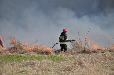 This is a view of fire by the Vistula river in Warsaw. April 11, 2015. Beach by the Vistula river in Warsaw, Poland.のeditorial素材