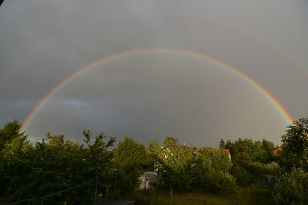 This is a view of a double rainbow on the sky.の写真素材