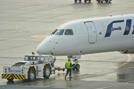 This is a view of Finnair plane Embraer ERJ 190 registered as OH-LKH outputting on the Warsaw Chopin Airport. February 2, 2016. Warsaw, Poland.のeditorial素材