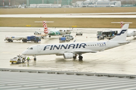 This is a view of Finnair plane Embraer ERJ 190 registered as OH-LKH outputting on the Warsaw Chopin Airport. February 2, 2016. Warsaw, Poland.のeditorial素材