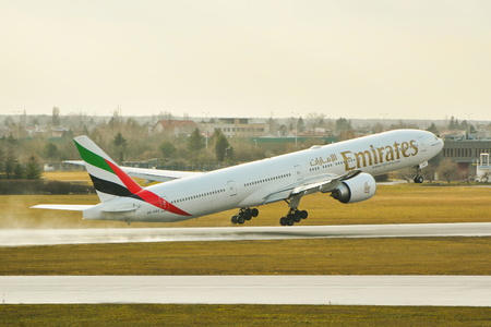 This is a view of Emirates plane Boeing 777-300 registered as A6-EBZ on the Warsaw Chopin Airport. February 2, 2016. Warsaw, Poland.のeditorial素材