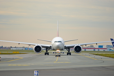 This is a view of Emirates Boeing 777-300ER plane registered as A6-EPR on the Warsaw Chopin Airport. On November 4, 2016. Warsaw, Poland.のeditorial素材